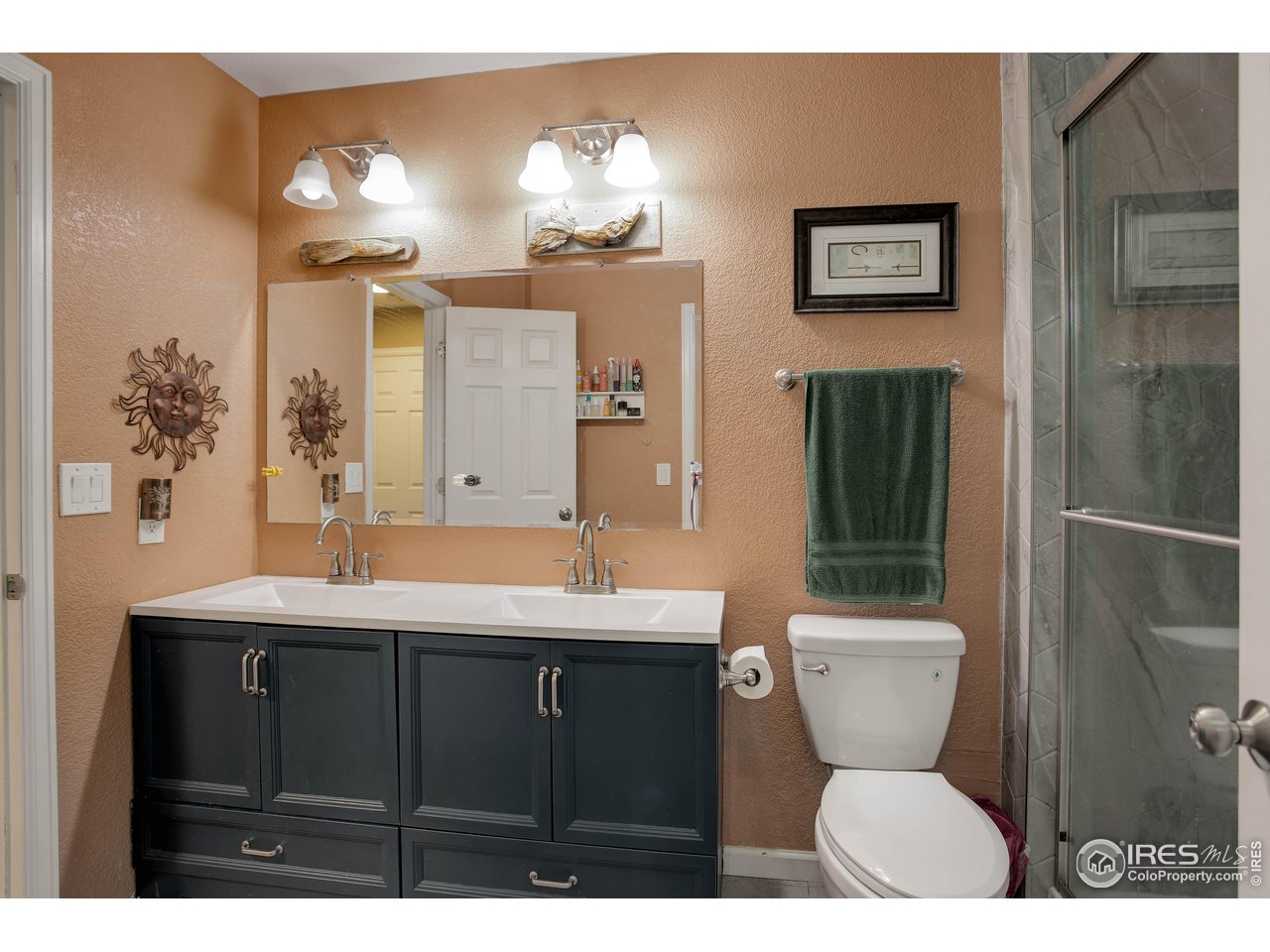 1205 Trail Ridge Road Longmont, CO 80504 - Photo 16 of 23 a bathroom with a sink toilet and shower