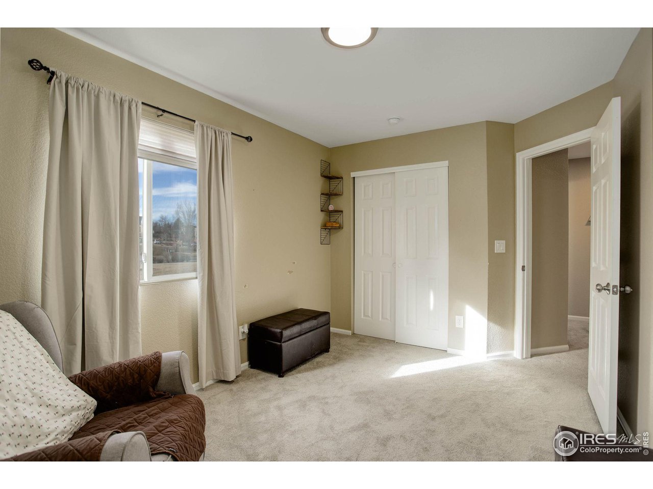 1205 Trail Ridge Road Longmont, CO 80504 - Photo 18 of 23 a living room with furniture and a window
