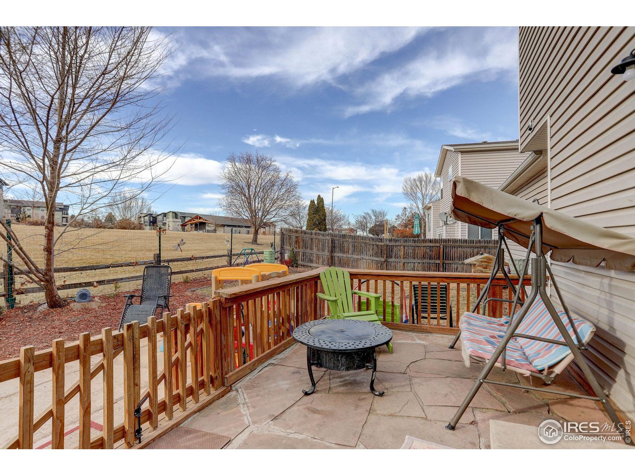 1205 Trail Ridge Road Longmont, CO 80504 - Photo 23 of 23 a view of a chairs and table on the terrace