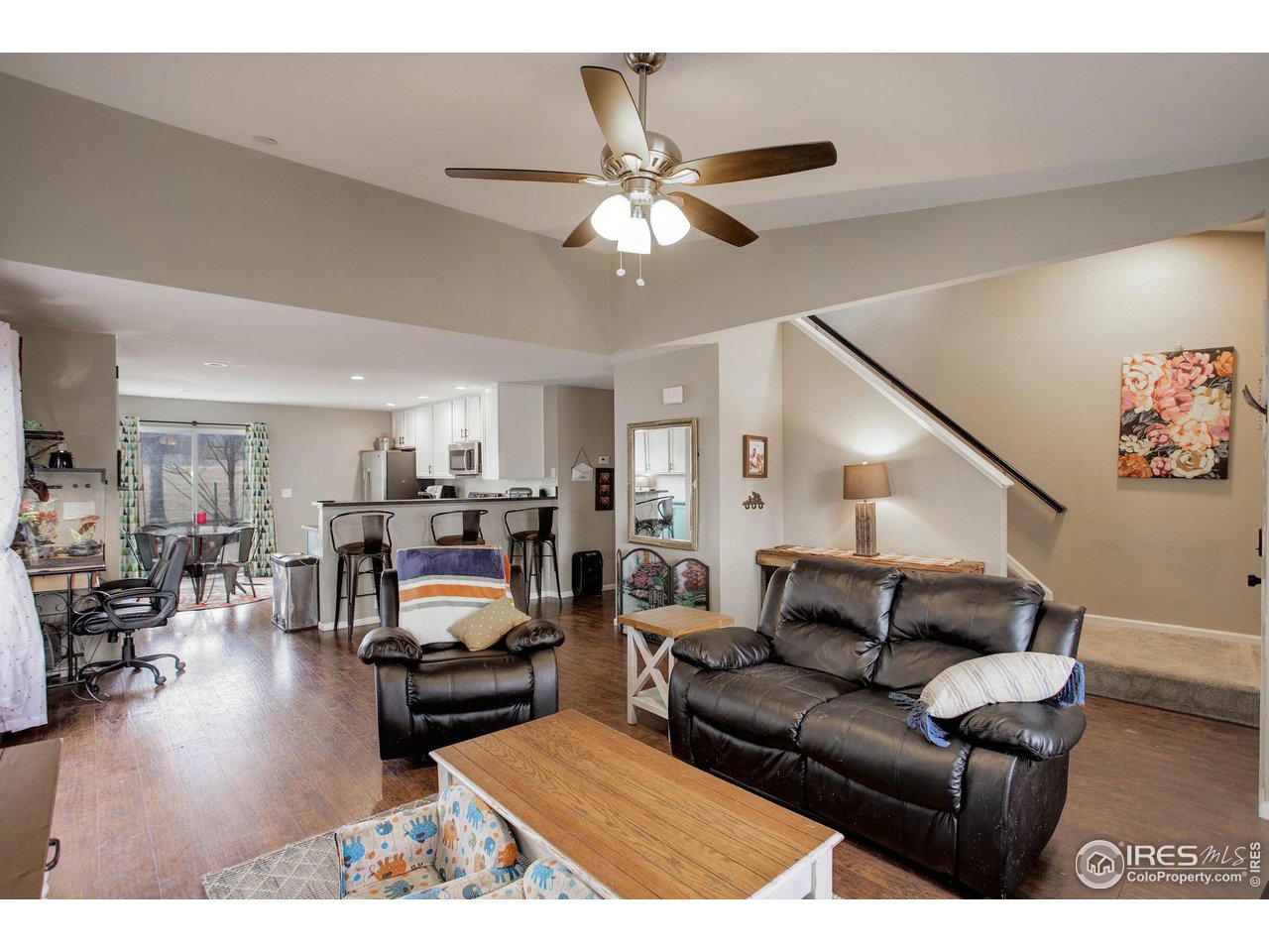 1205 Trail Ridge Road Longmont, CO 80504 - Photo 5 of 23 a living room with furniture and a wooden floor