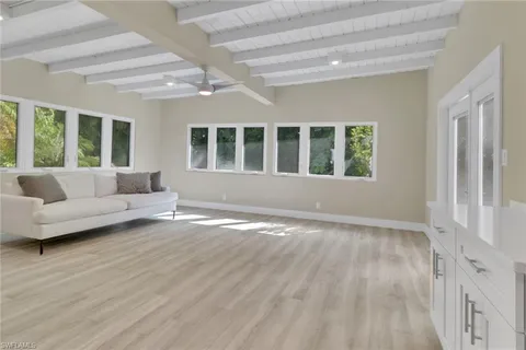 a view of livingroom with furniture wooden floor and window