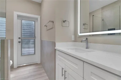 a bathroom with a sink and a mirror