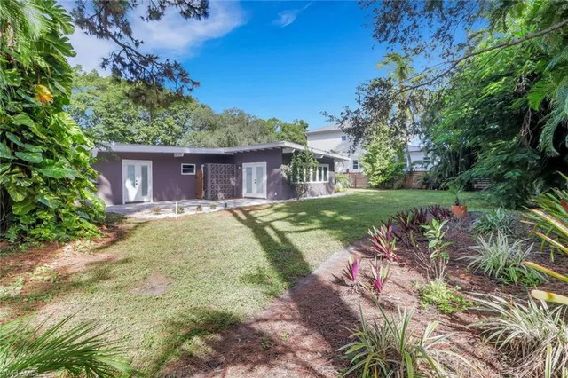 a view of a house with a yard