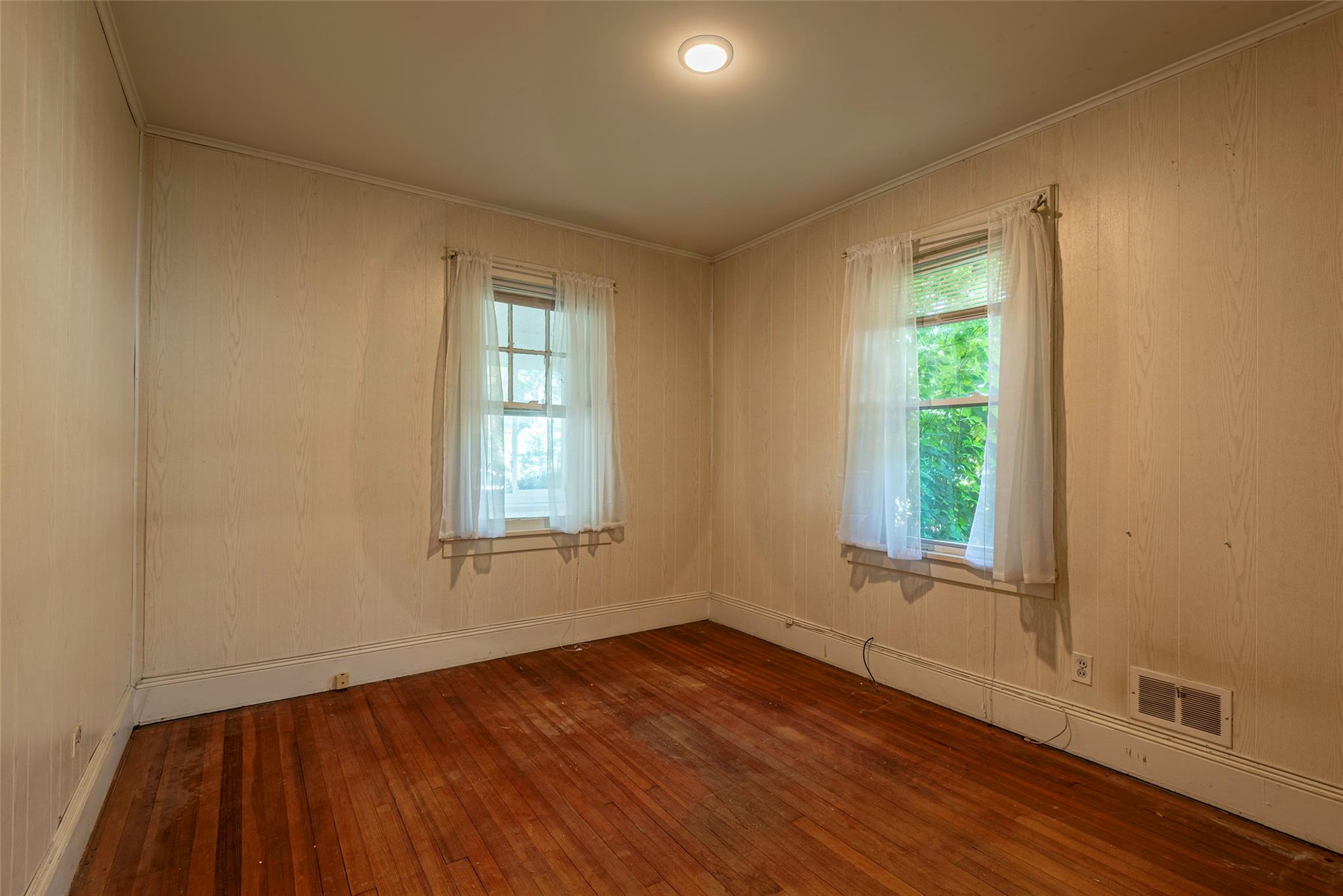 2 Florence Street Baldwin, NY 11510 - Photo 17 of 38 Unfurnished room with wood-type flooring and crown molding