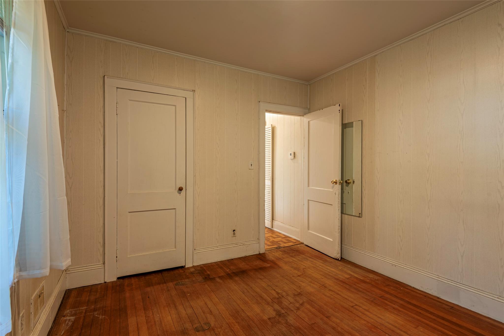 2 Florence Street Baldwin, NY 11510 - Photo 20 of 38 Empty room with wood-type flooring and crown molding