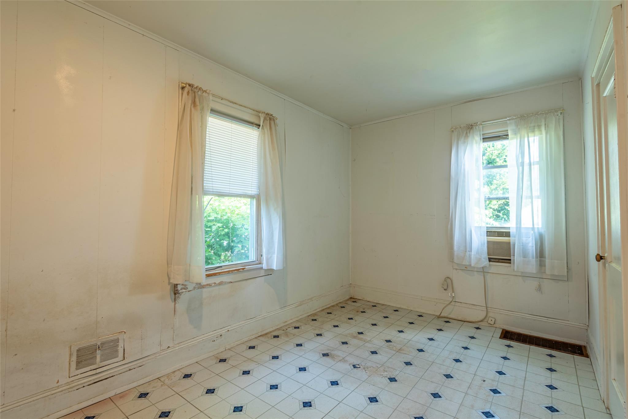 2 Florence Street Baldwin, NY 11510 - Photo 22 of 38 Spare room featuring healthy amount of natural light and light flooring