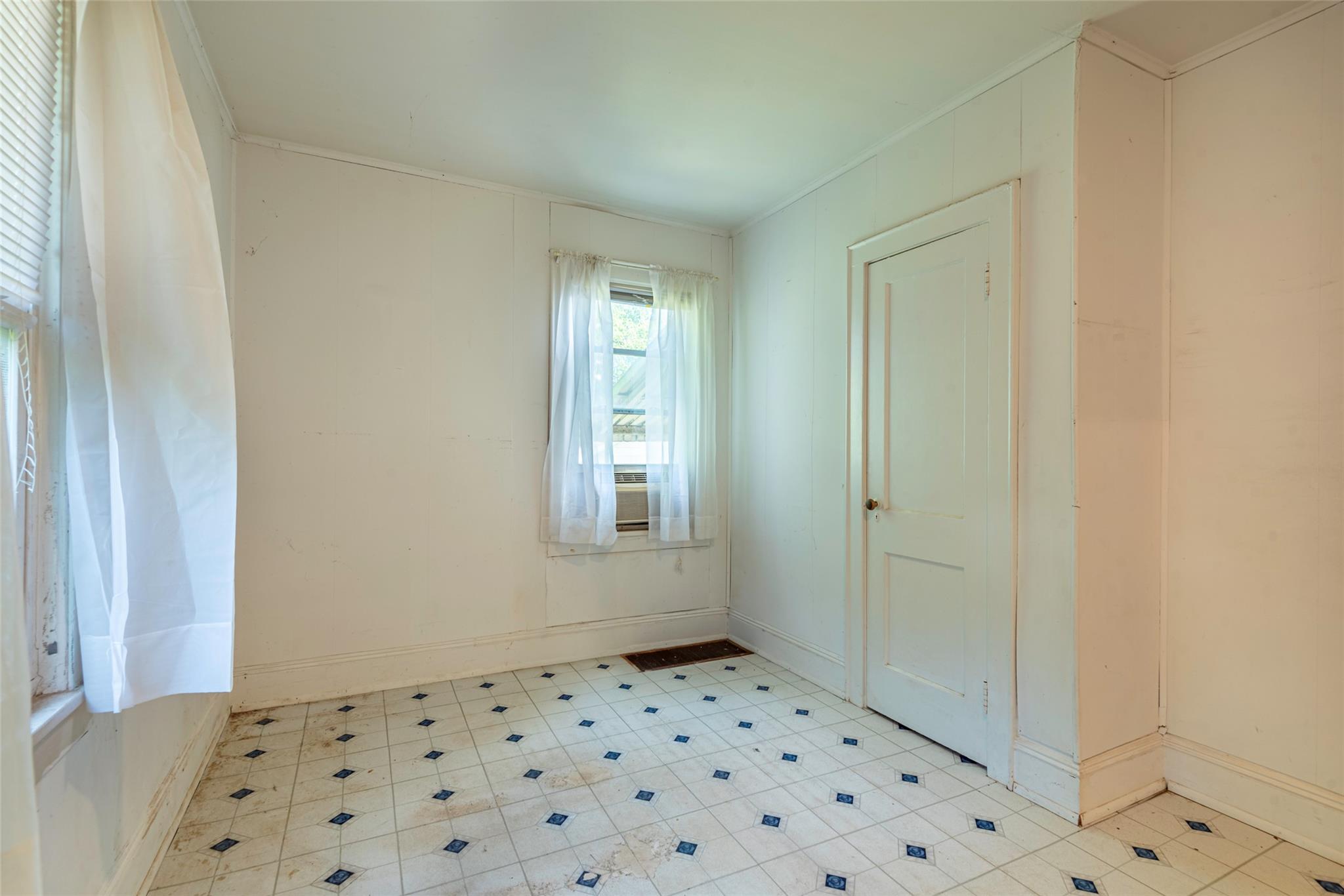 2 Florence Street Baldwin, NY 11510 - Photo 23 of 38 Spare room featuring crown molding and baseboards