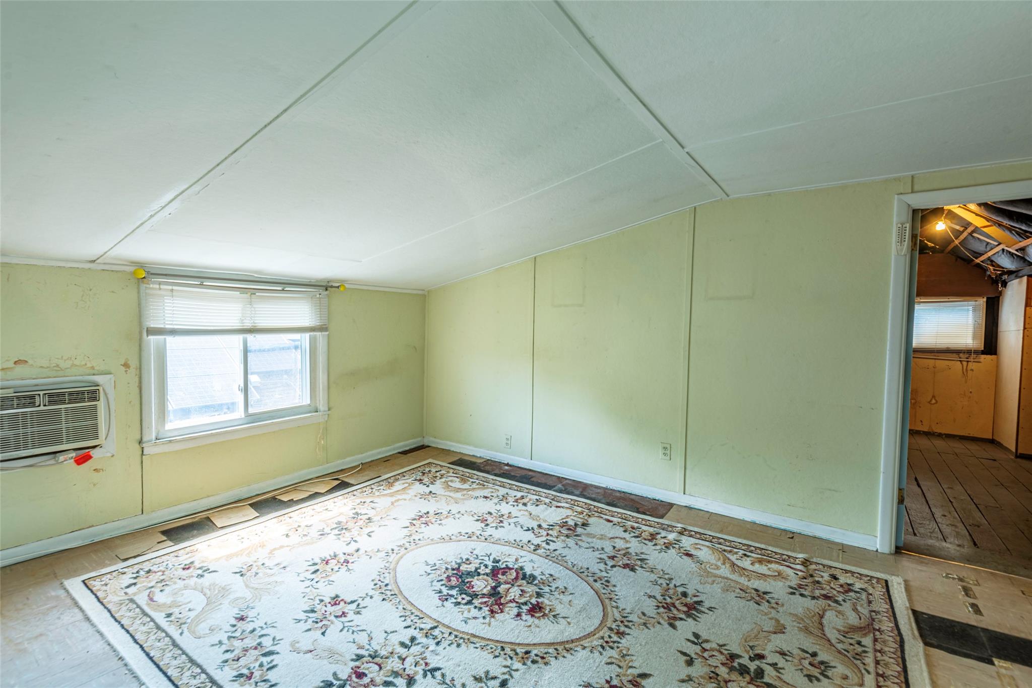 2 Florence Street Baldwin, NY 11510 - Photo 25 of 38 Additional living space with vaulted ceiling and a wall unit AC