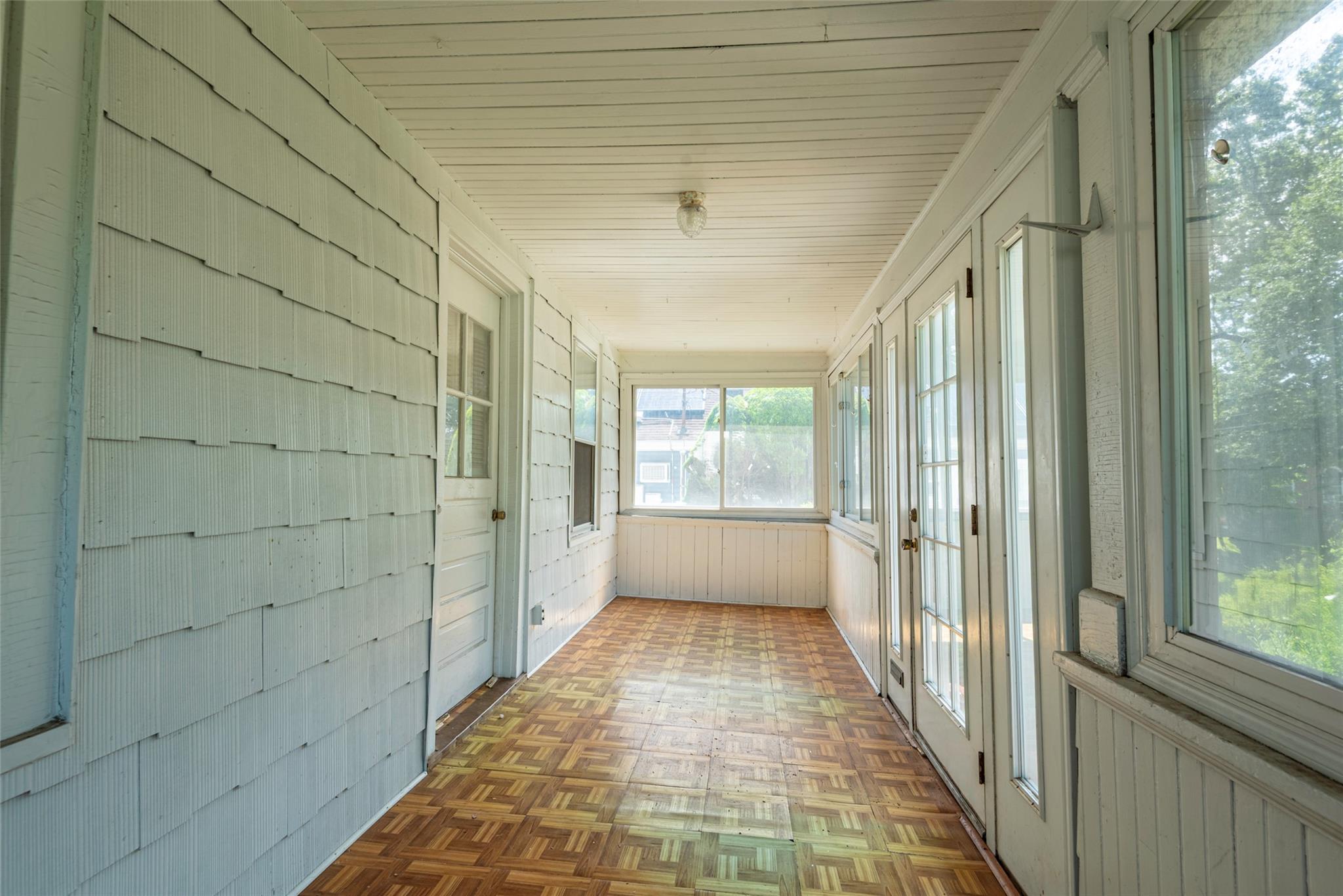 2 Florence Street Baldwin, NY 11510 - Photo 5 of 38 Unfurnished sunroom featuring wooden walls