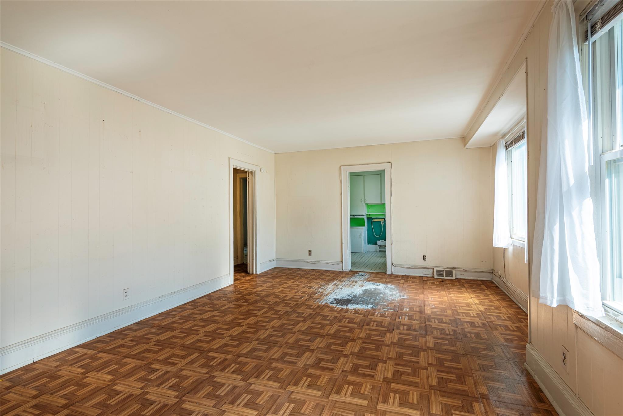 2 Florence Street Baldwin, NY 11510 - Photo 7 of 38 Unfurnished room featuring baseboards and crown molding