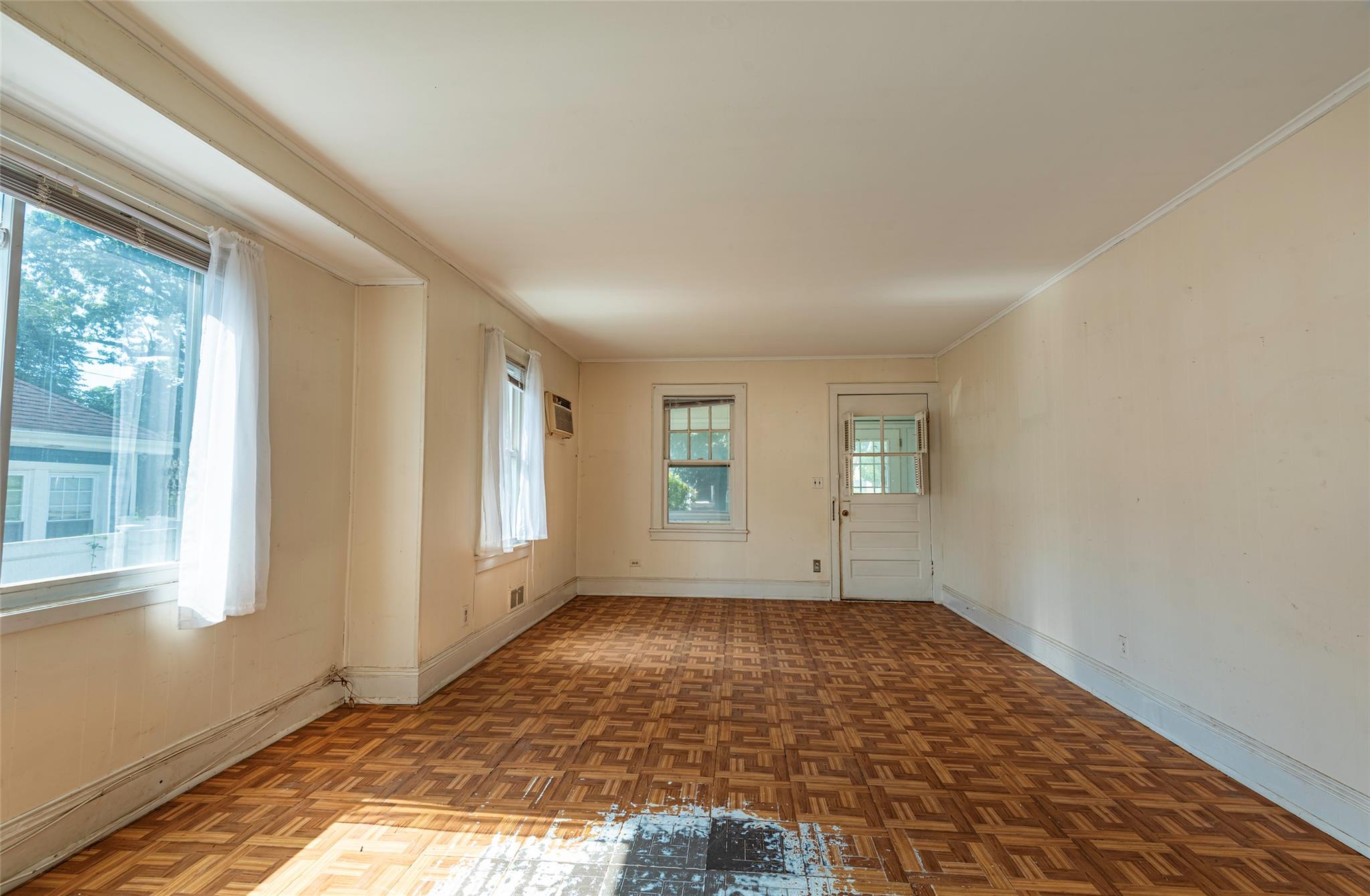 2 Florence Street Baldwin, NY 11510 - Photo 10 of 38 Empty room featuring crown molding and a wall unit AC