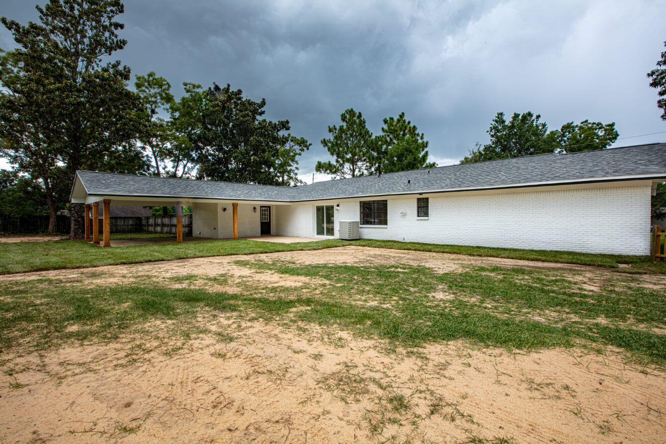 1414 Red Oak Drive Crestview, FL 32539 - Photo 30 of 34 a front view of house with yard and trees around