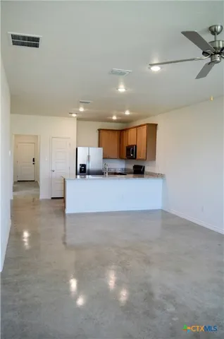 a view of a kitchen with a sink and a microwave