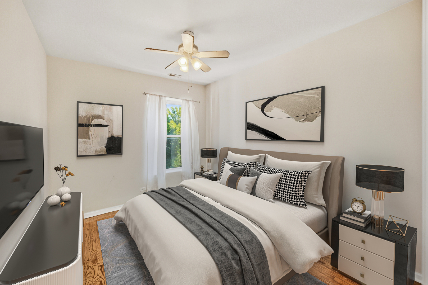 6712 South Ridgeland Avenue, Unit 3A Chicago, IL 60649 - Photo 4 of 14 a bedroom with a bed and a flat screen tv