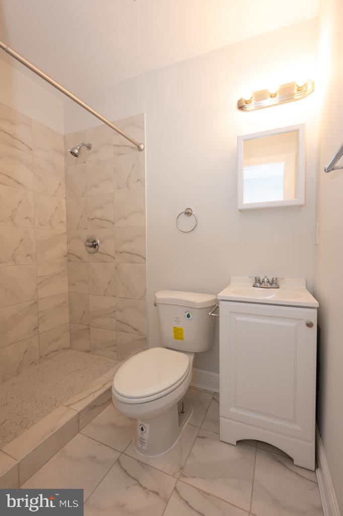 3321 11th Street Northwest, Unit 1 Washington, DC 20010 - Photo 5 of 10 a bathroom with a toilet sink and a shower