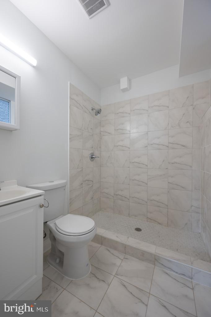 3321 11th Street Northwest, Unit 1 Washington, DC 20010 - Photo 8 of 10 a bathroom with a toilet and a shower
