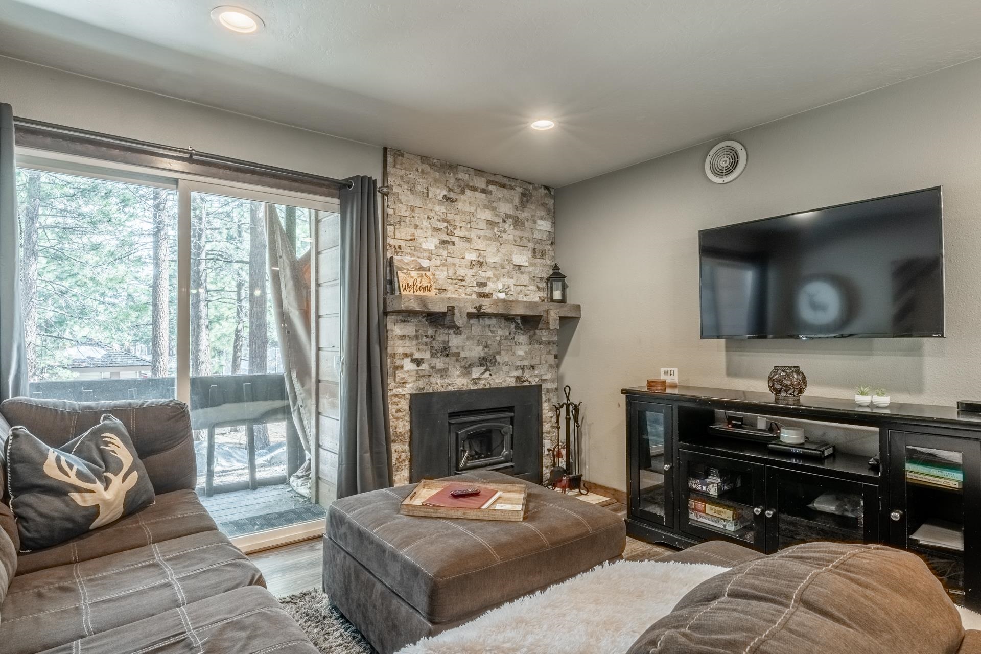 2499 Sierra Nevada Road, Unit S1 Mammoth Lakes, CA 93546 - Photo 4 of 38 Living room featuring wood finished floors, a stone fireplace, and recessed lighting