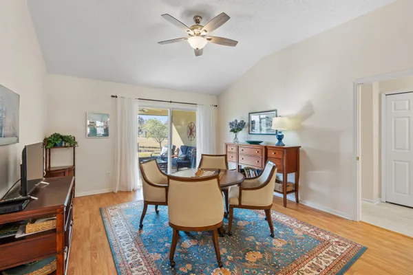 a view of a dining room with furniture window and outside view