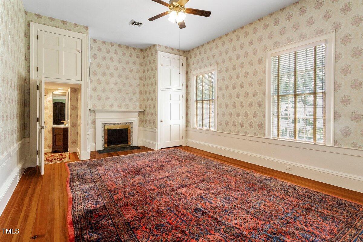 206 Shaver Road Macon, NC 27551 - Photo 41 of 68 a view of an empty room with window and fire place