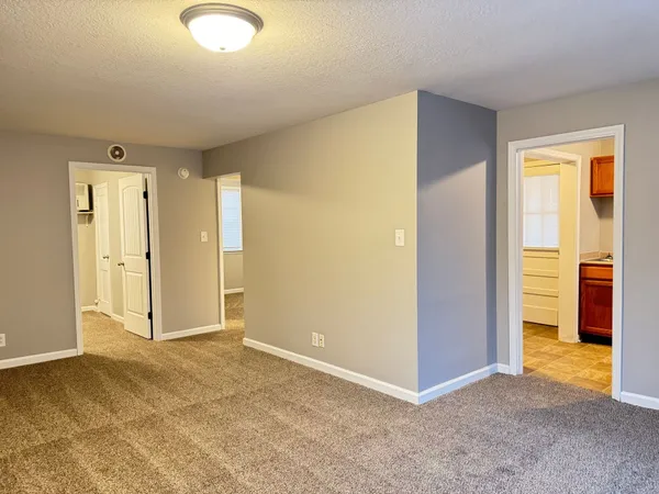 an empty room with a bathroom