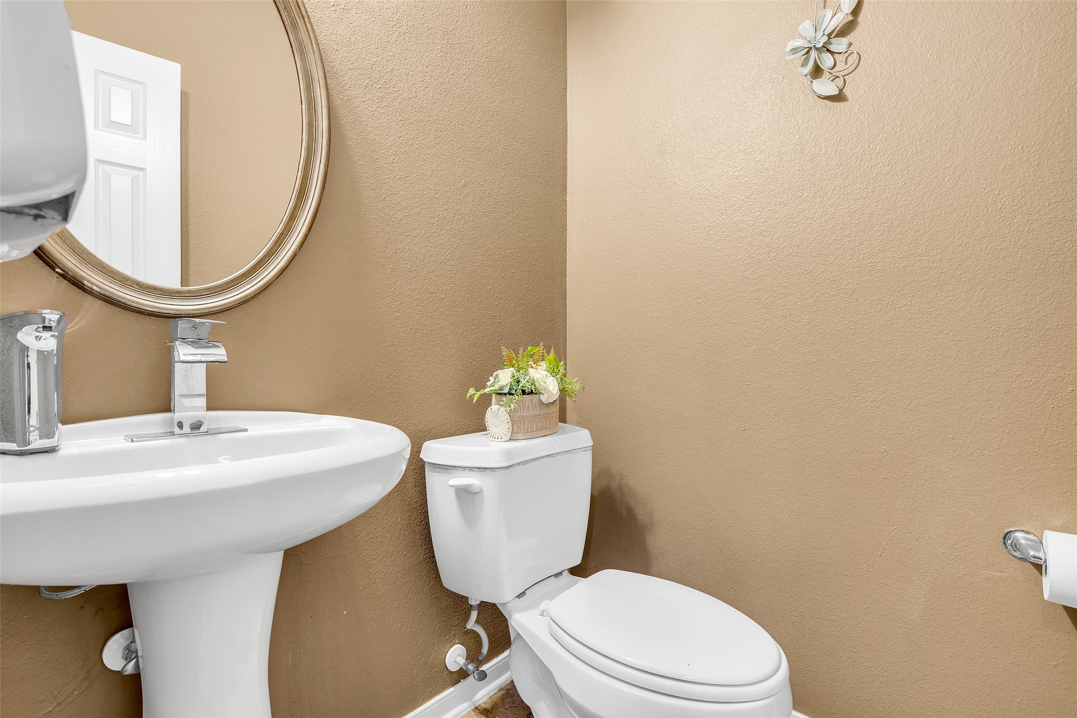 611 River Delta Lane Rosenberg, TX 77469 - Photo 24 of 39 a bathroom with a sink mirror a toilet and a mirror