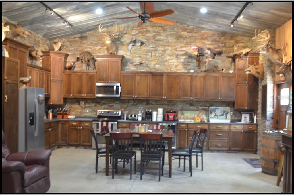 7019 Crooked Creek Lane Zolfo Springs, FL 33890 - Photo 11 of 51 a view of a dining room with furniture