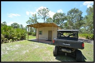 7019 Crooked Creek Lane Zolfo Springs, FL 33890 - Photo 15 of 51 a front view of a house with garden
