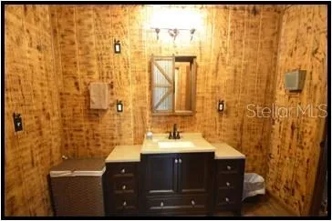 a bedroom with a bed and a table