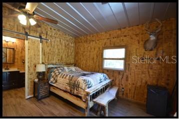 7019 Crooked Creek Lane Zolfo Springs, FL 33890 - Photo 18 of 51 a bed sitting in a bedroom next to a window