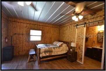 7019 Crooked Creek Lane Zolfo Springs, FL 33890 - Photo 19 of 51 a bedroom with a bed and a table