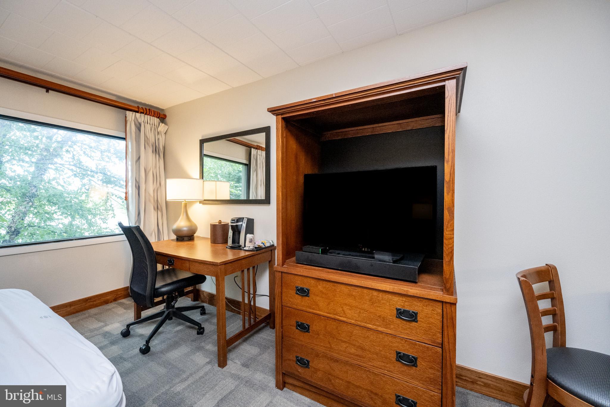 290 Marsh Hill Road, Unit 224A McHenry, MD 21541 - Photo 11 of 30 a view of a workspace with furniture and a window