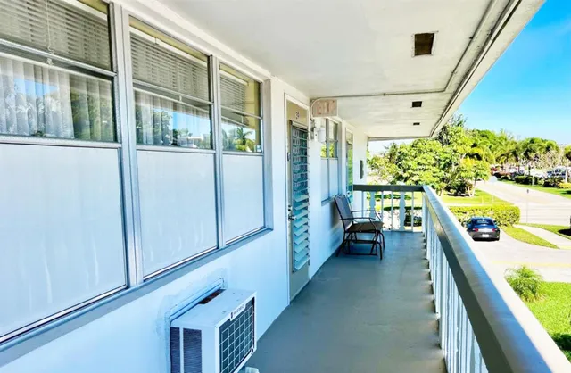 a view of a living room with a large window