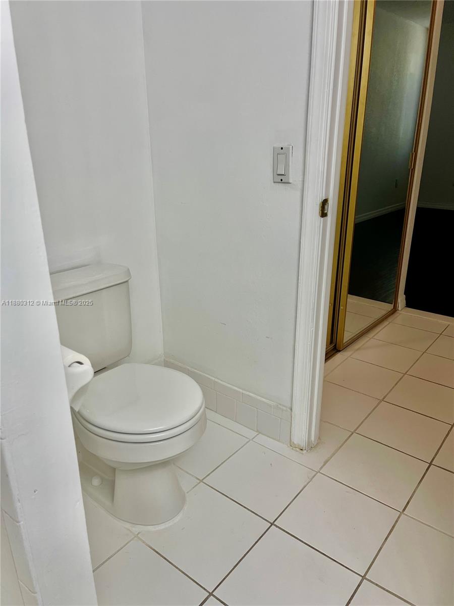 6800 Cypress Road, Unit 408 Plantation, FL 33317 - Photo 15 of 25 a bathroom with a toilet and a shower