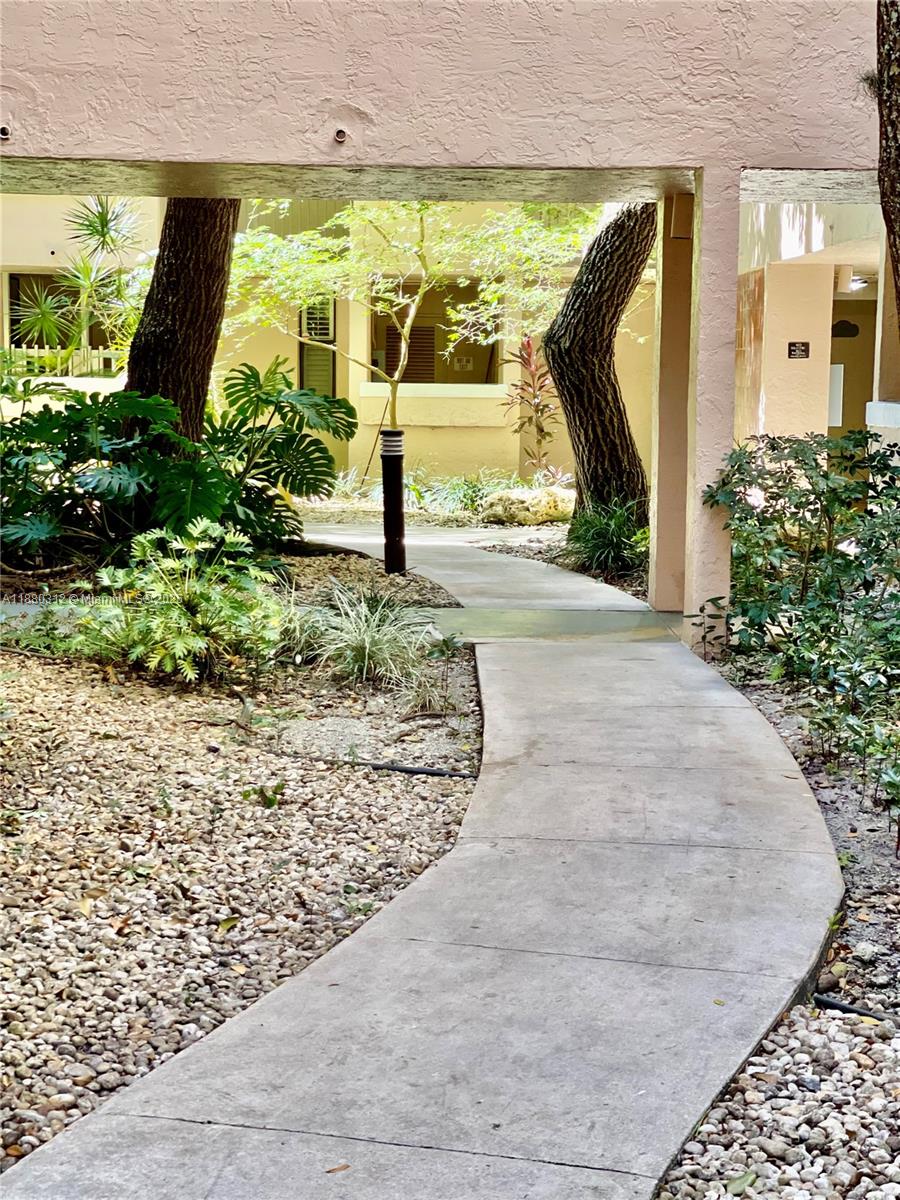 6800 Cypress Road, Unit 408 Plantation, FL 33317 - Photo 2 of 25 a view of a garden