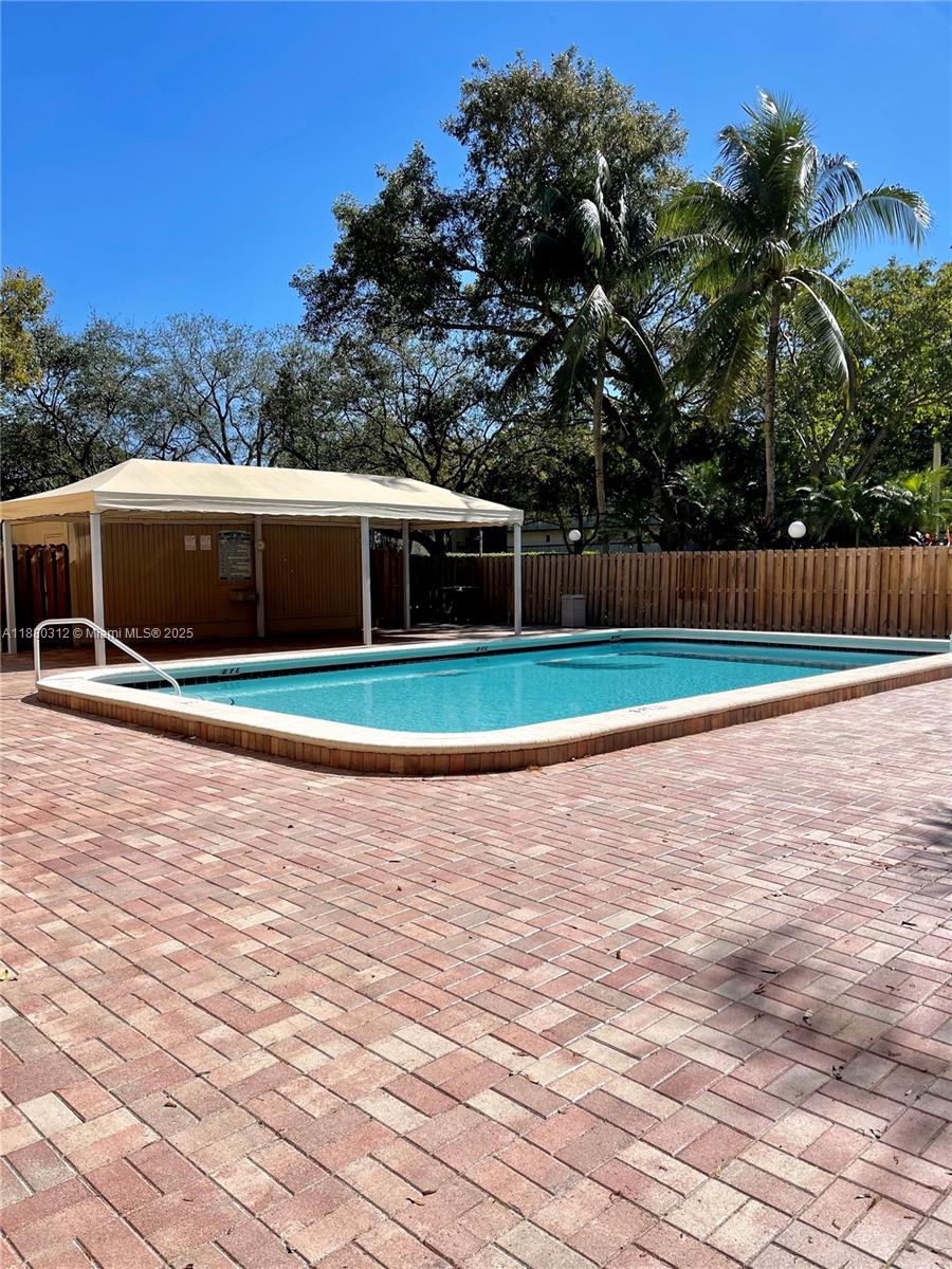 6800 Cypress Road, Unit 408 Plantation, FL 33317 - Photo 25 of 25 a view of swimming pool with trees in the background