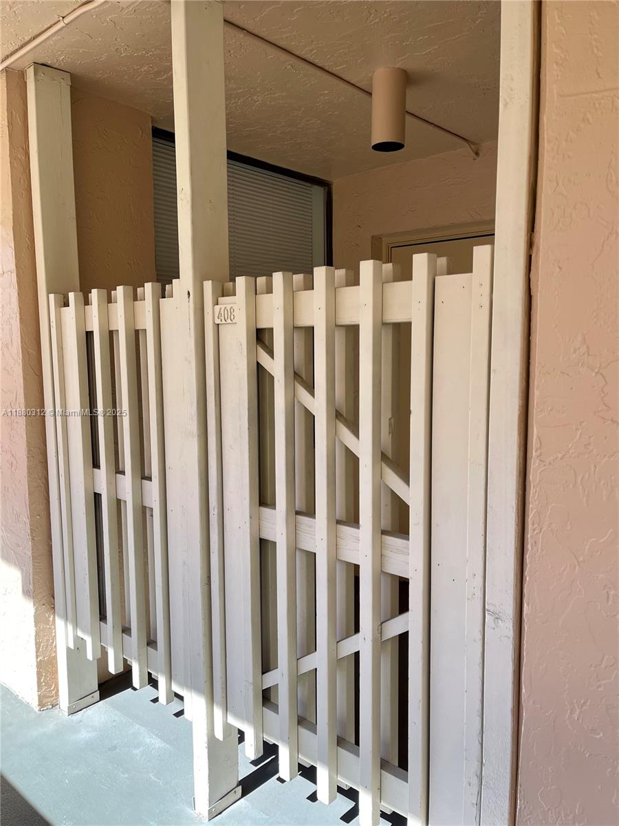 6800 Cypress Road, Unit 408 Plantation, FL 33317 - Photo 3 of 25 a view of a door with a chair