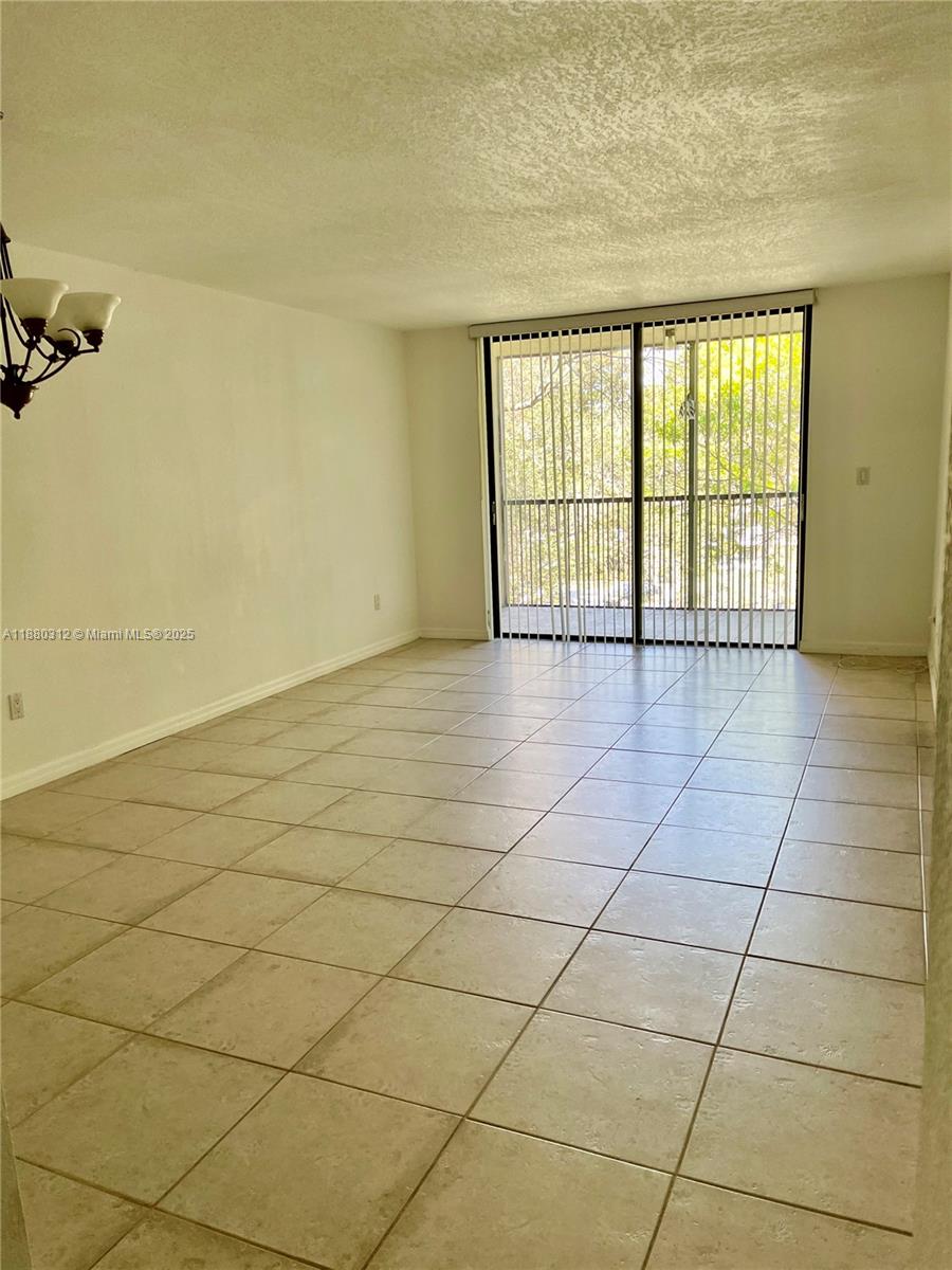 6800 Cypress Road, Unit 408 Plantation, FL 33317 - Photo 5 of 25 a view of an empty room and a window