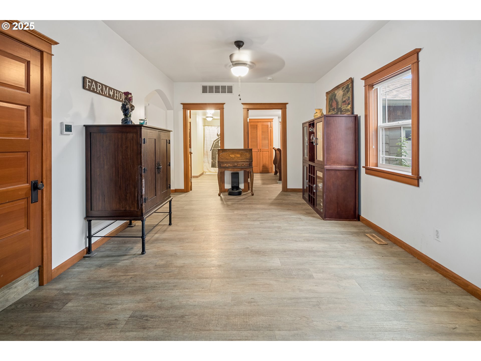 16326 Butteville Road Northeast Woodburn, OR 97071 - Photo 13 of 48 a view of a livingroom with furniture a ceiling fan and window