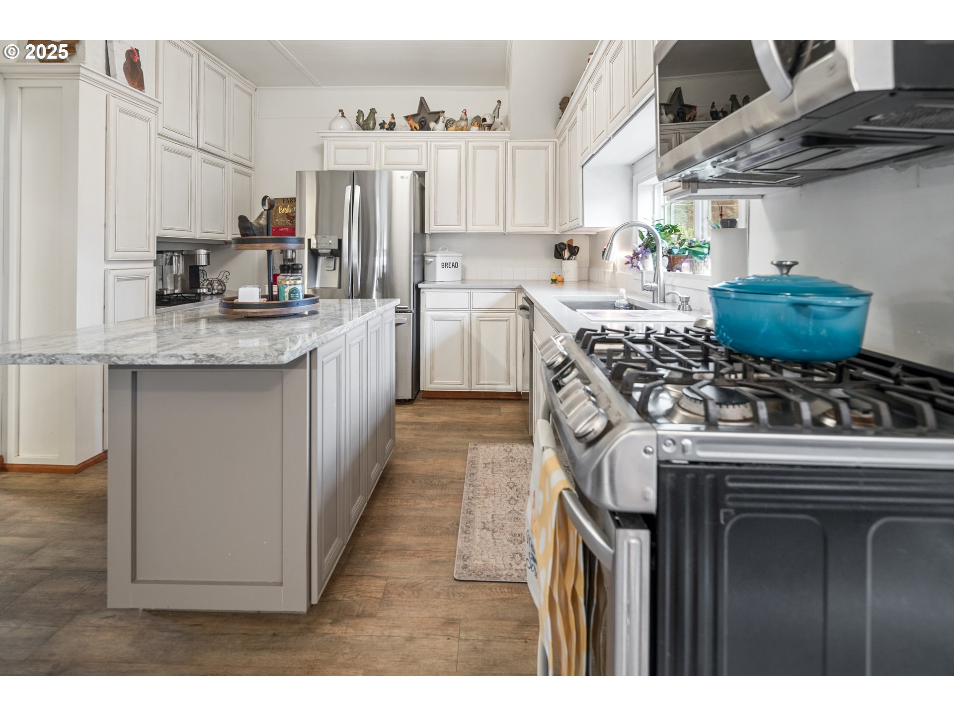 16326 Butteville Road Northeast Woodburn, OR 97071 - Photo 21 of 48 a kitchen with stainless steel appliances granite countertop a stove and a sink