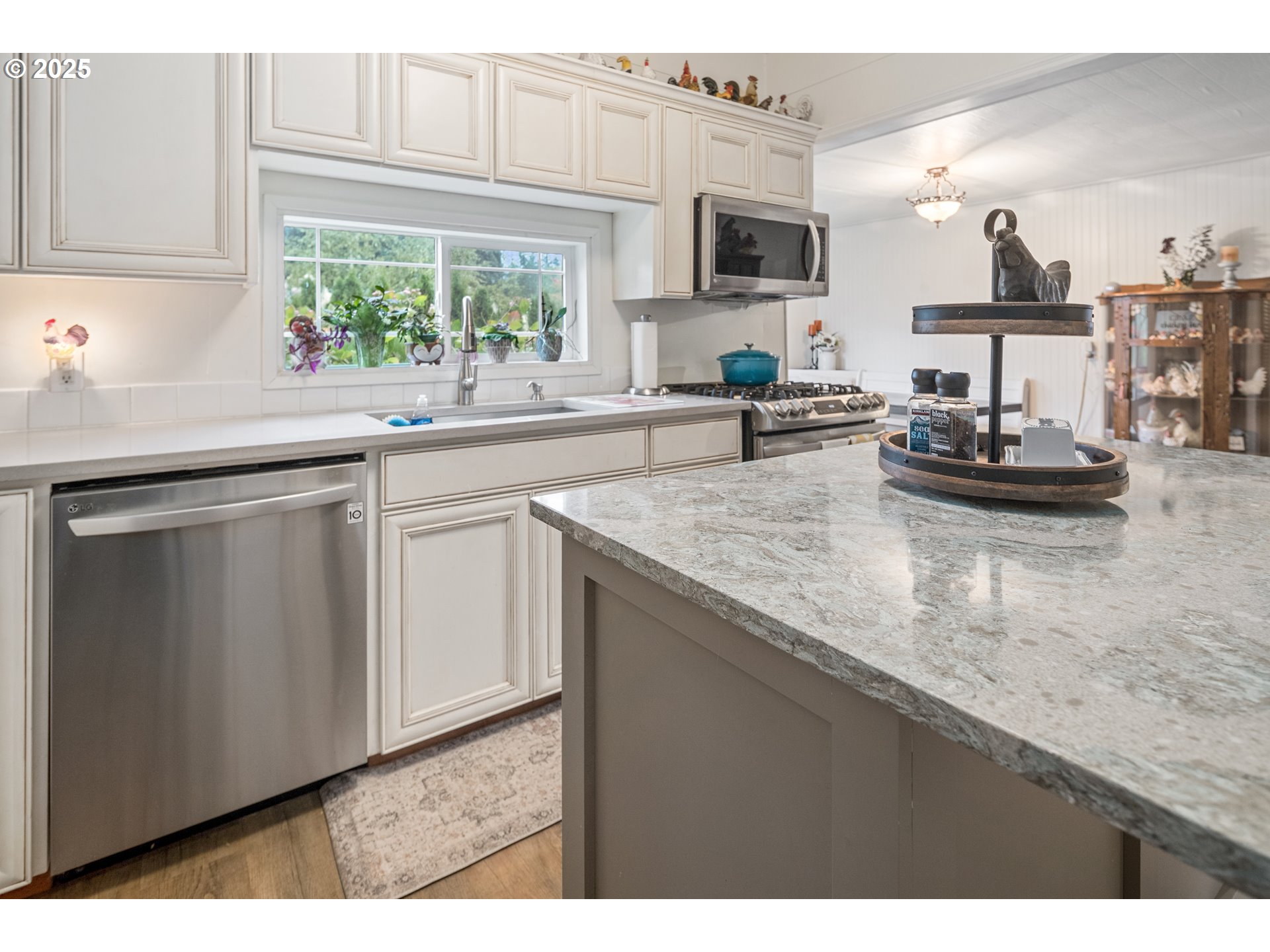 16326 Butteville Road Northeast Woodburn, OR 97071 - Photo 24 of 48 a kitchen with sink cabinets and microwave