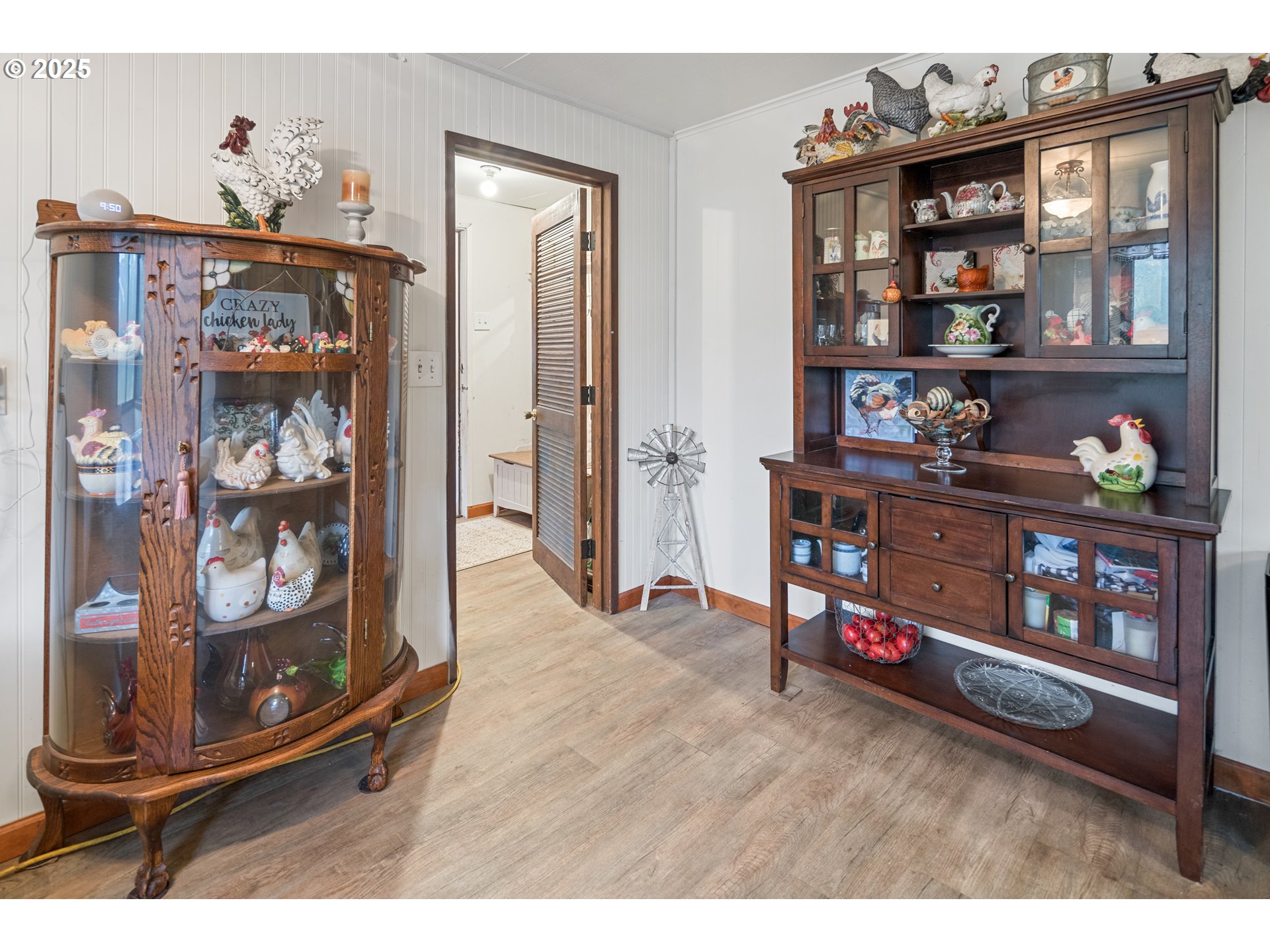 16326 Butteville Road Northeast Woodburn, OR 97071 - Photo 26 of 48 a living room with lots of furniture and a wooden floor