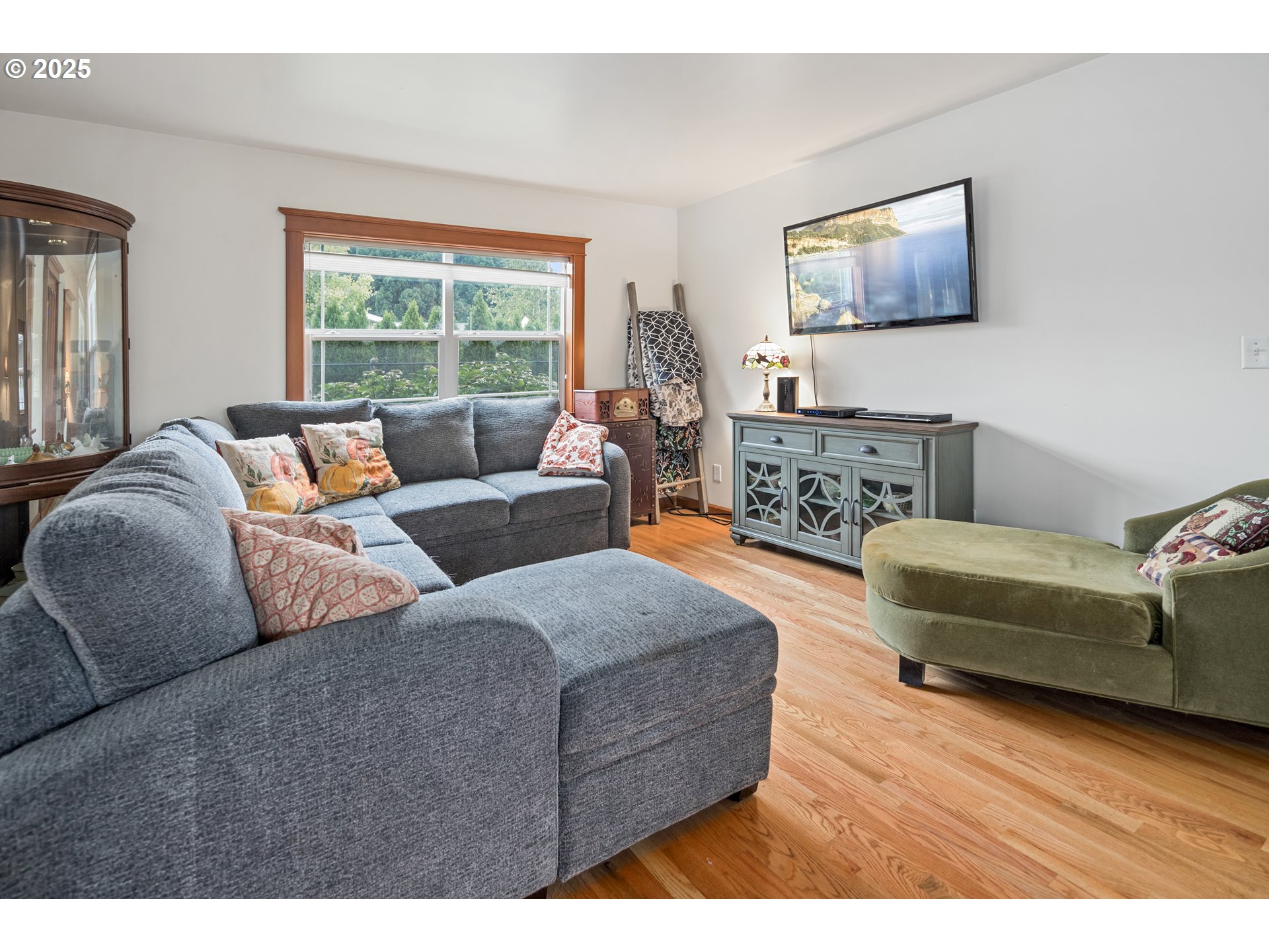 16326 Butteville Road Northeast Woodburn, OR 97071 - Photo 6 of 48 a living room with furniture and a flat screen tv