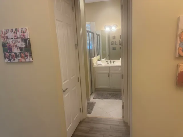 a bathroom with a glass shower door