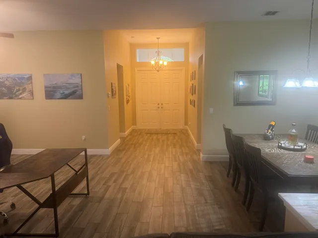 a view of a livingroom with furniture and wooden floor
