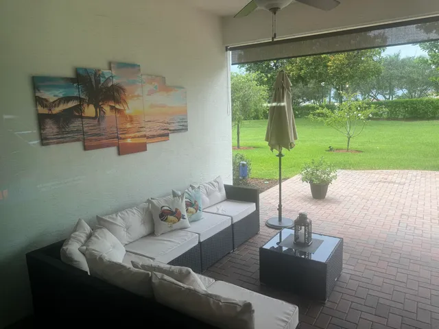 a living room with furniture and a garden