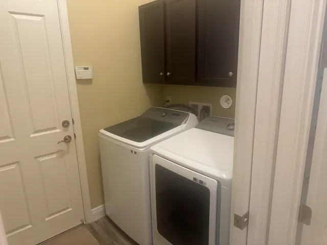 a utility room with dryer and washer