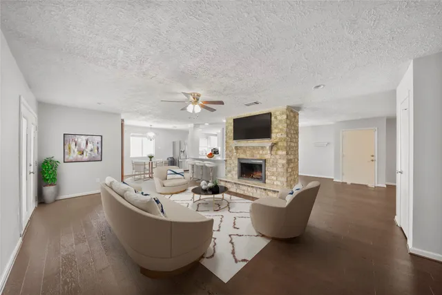 a living room with furniture and a fireplace