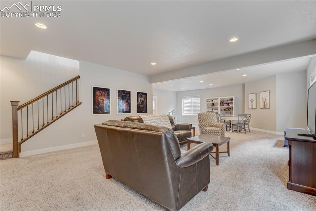 11590 Spectacular Bid Circle Colorado Springs, CO 80921 - Photo 27 of 49 a living room with furniture and a table