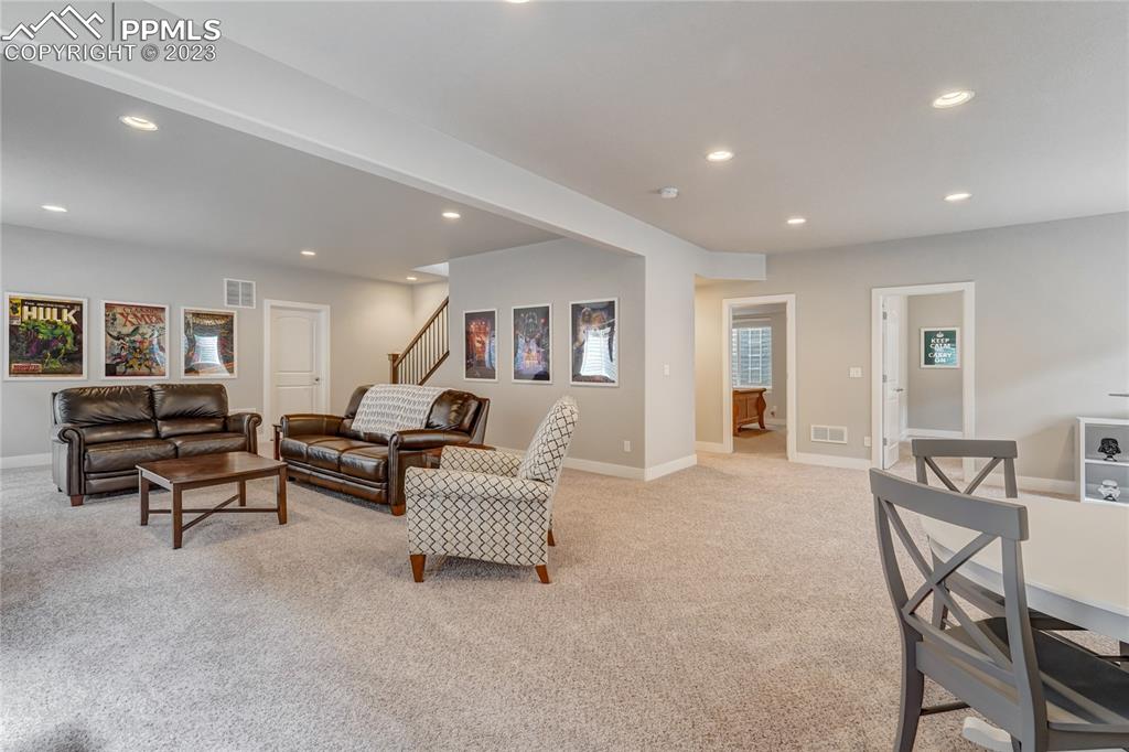 11590 Spectacular Bid Circle Colorado Springs, CO 80921 - Photo 28 of 49 a living room with furniture and a table