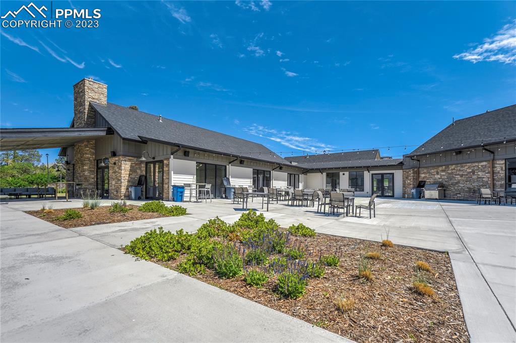 11590 Spectacular Bid Circle Colorado Springs, CO 80921 - Photo 42 of 49 a view of a house with dining space and a patio